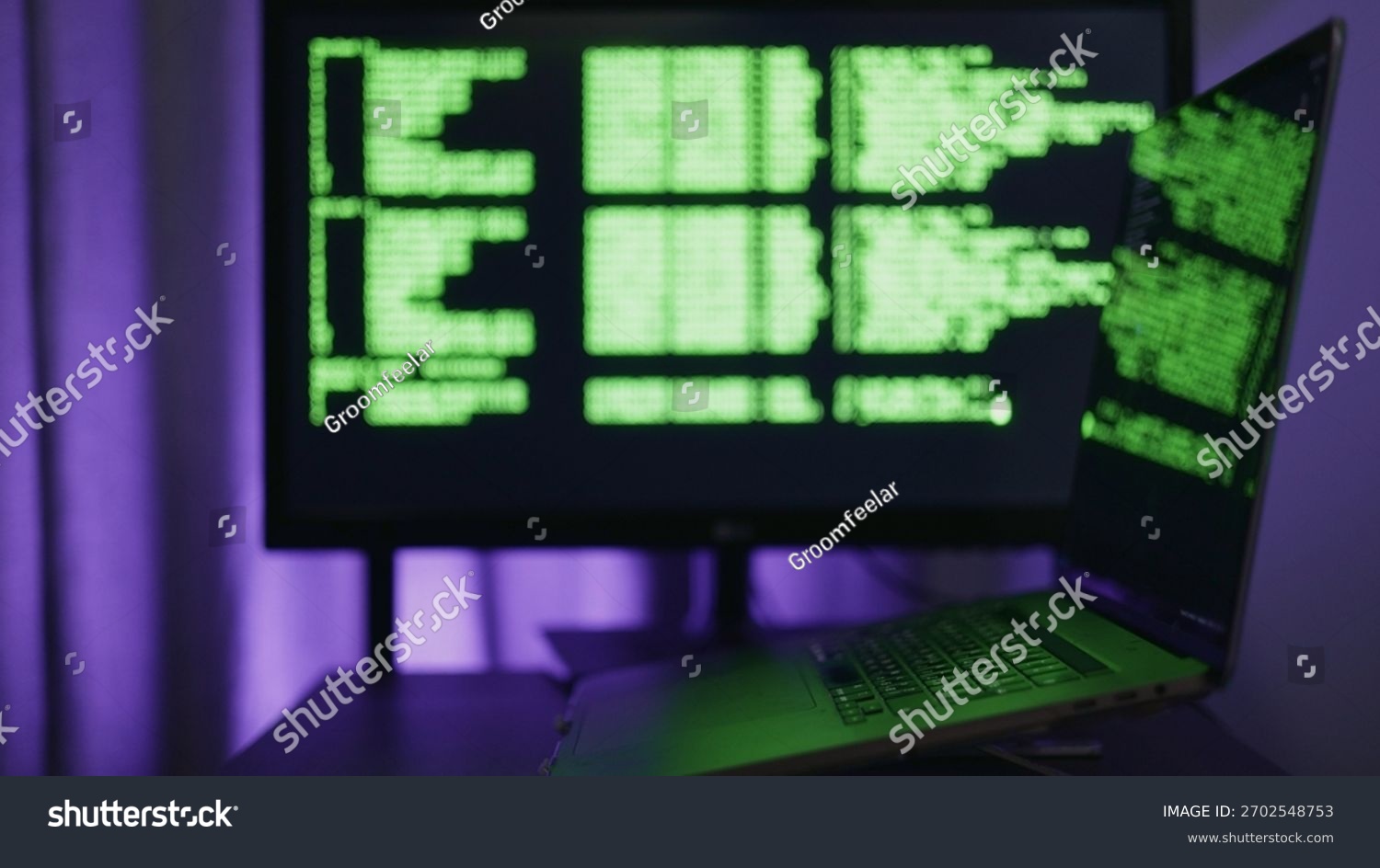 Developer working on a laptop at night with code on the screen